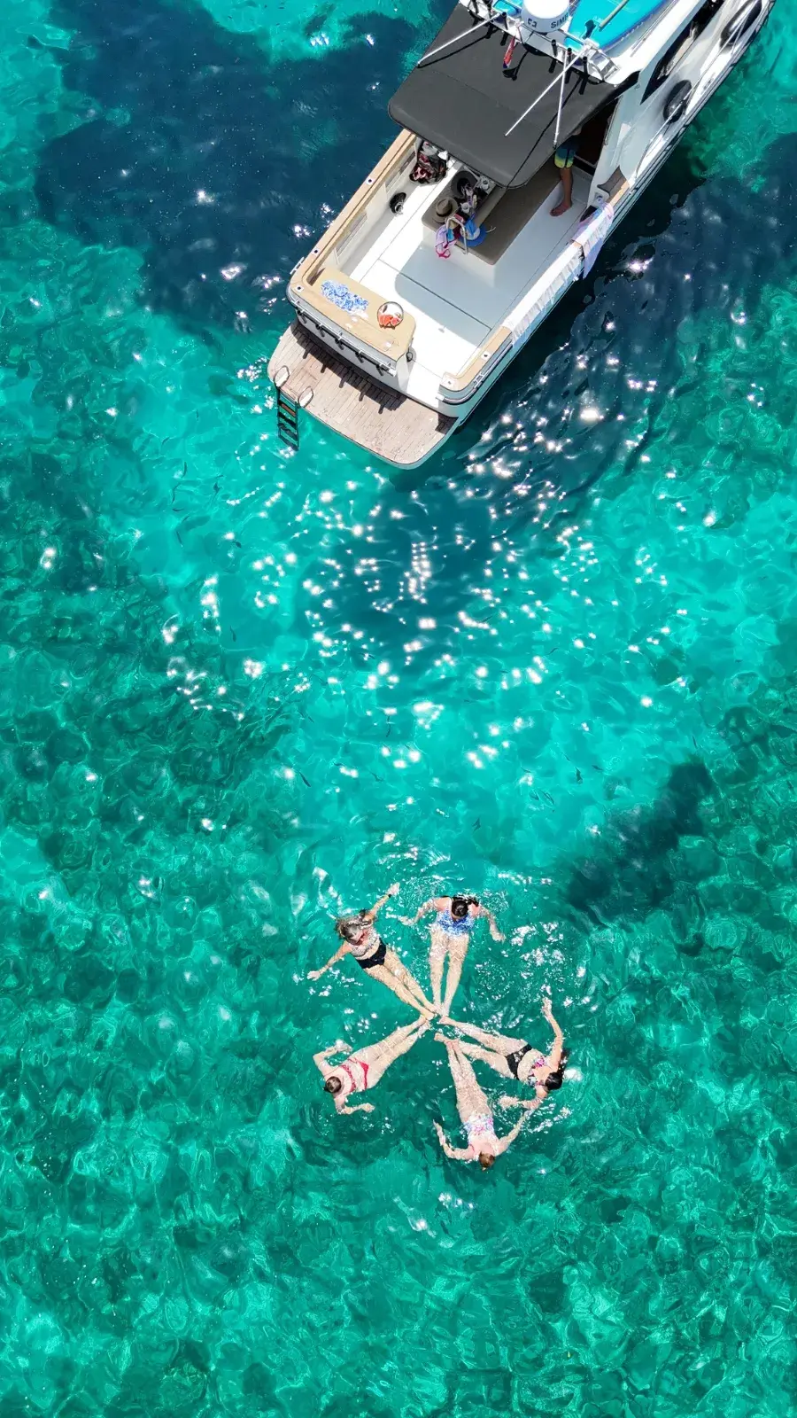 Anchored boat at a hidden beach
